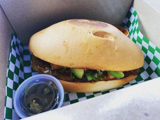 Delicious Torta served with pickled jalapeños and salsa.