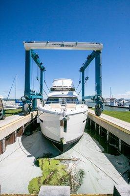 We have a travel lift to move those larger boats in and out of the water. Contact our service department for more information.