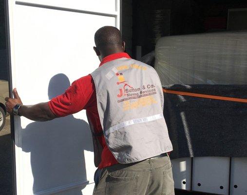 J Sutton and Co - Move Coordinator loading a portable container in Long Island New York for long distance move.