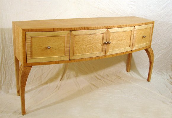 Bow-front sideboard in bird's-eye maple