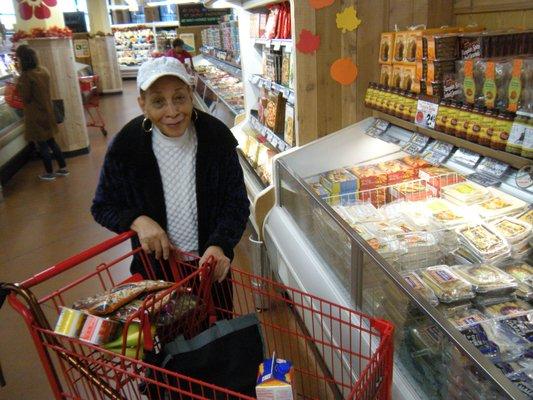 A happy shopper who rides our Shopping Bus