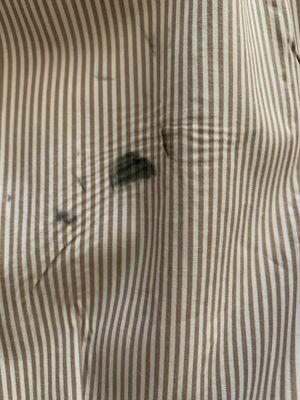 Up close, you can see they scorched the shirt with the iron as well.