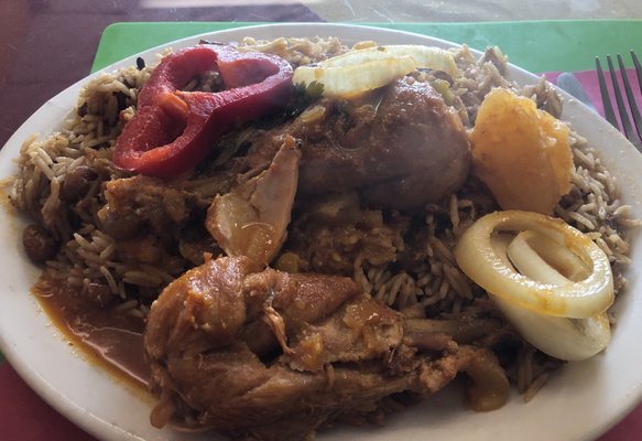 Chicken stew over rice and beans