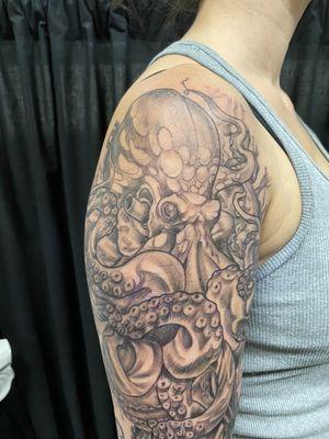 Close up of an Octopus, black and grey, quarter sleeve.