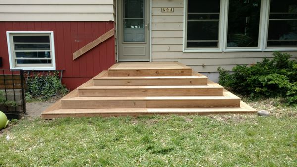 This was a set of old concrete steps. Steps were removed and replaced with new wood steps.