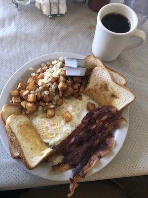 Over easy eggs, I asked for extra crispy bacon.  It's exactly what I got! Home toast home fries/ onions and coffee. Delicious