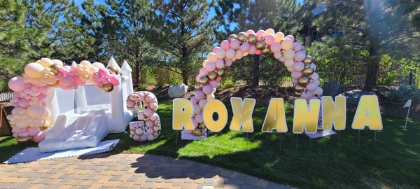 Outdoor setup of a 8ft balloon garland, a balloon arch and a 4ft 
balloon mosaic with high quality latex balloons