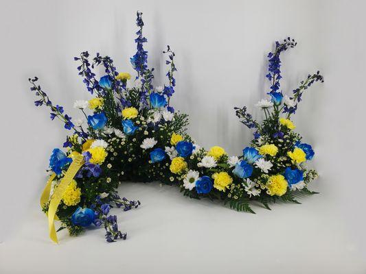 Urn Arrangement for a funeral service. Done in yellows and blues.