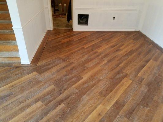 Custom vinyl plank flooring on diagonal with boarder done by hawkins