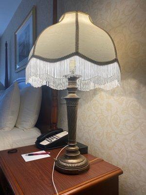 Bedside lamp with tassels.