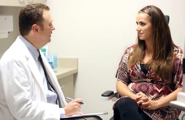 Dr. Tracy consults with a patient before LASIK.