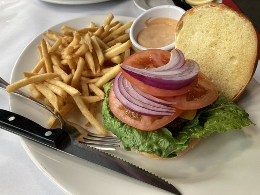 The burger- cooked medium rare and comes with fries and a spicy chipotle mayo.