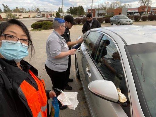 Monica, Abraham and dude from the oil change place next door selflessly helping me clean the car.