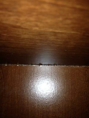 The splintering edge of one of the cabinets.