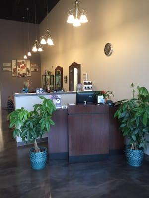 Warm and inviting front desk reception area. Nice lighting throughout salon. Everyone is nice and welcoming.