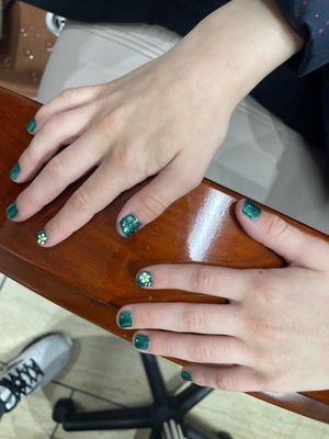 They painted my daughter's nails and put really pretty little flowers on them looks like daisies!