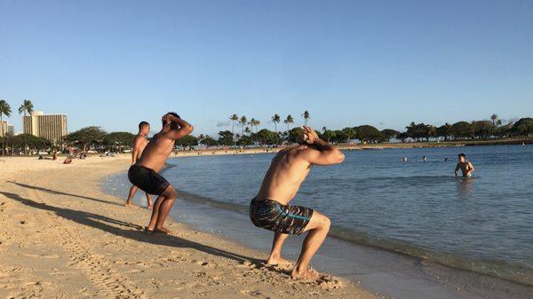 Surf n' Turf!  Both land and water exercises utilized for during our boot camp styled classes at Ala Moana Beach Park.