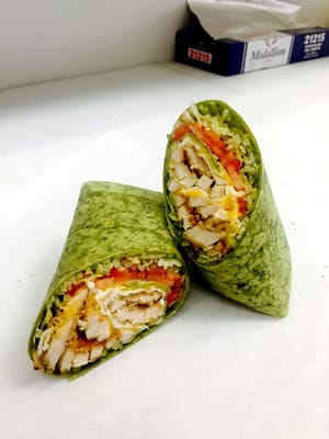 Chicken cutlet, melted yellow American and mozzarella, lettuce and tomato on a spinach wrap