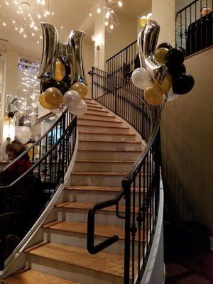 The staircase to the loft-style second floor is a great stage for group photos.