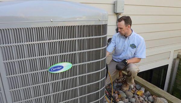 One of our certified technicians working on an AC unit.