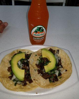 Steak taco's with avocado with a mexican orange soda