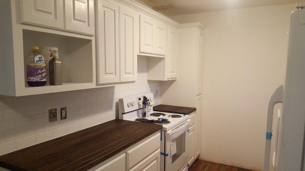 Installation of Hardwood Maple counter tops over custom cabinets.