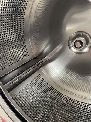 The inside of the washers are perfectly clean! that's what matters to me not so much the floors between the washers.