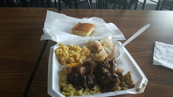 Oxtail, rice, gravy, mac n cheese, and cabbage with cornbread. So so good!!!!