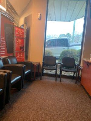 Very neat and clean waiting area. Has a coffee pot with cream and sugar.