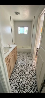 New tile shower, tile flooring, quartz countertop, and beautiful alder cabinets!