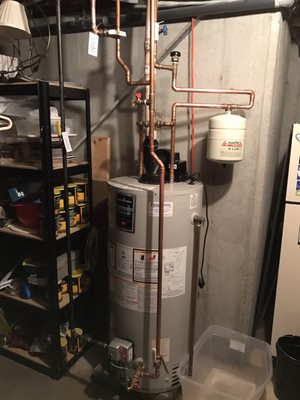 Power vented gas fired water heater