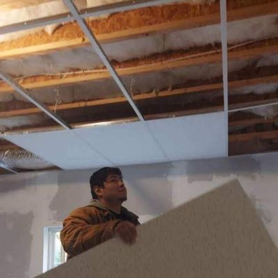 Me finishing up the room with a drop ceiling