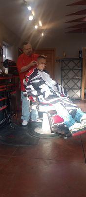 My friend getting his hair cutting after trying to cut it himself with dull clippers. This really is the place to come for a great cutting.