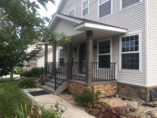 Redo porch with faux stone columns and faux stone panels. Trex decking, westbury rail.