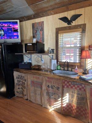 Kitchenette area. Refrigerator and microwave.