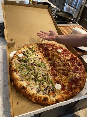 Giant pizza- half pepperoni and half pesto chicken. Delicious!