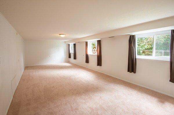 Big back room that has endless possibilities.. new carpet