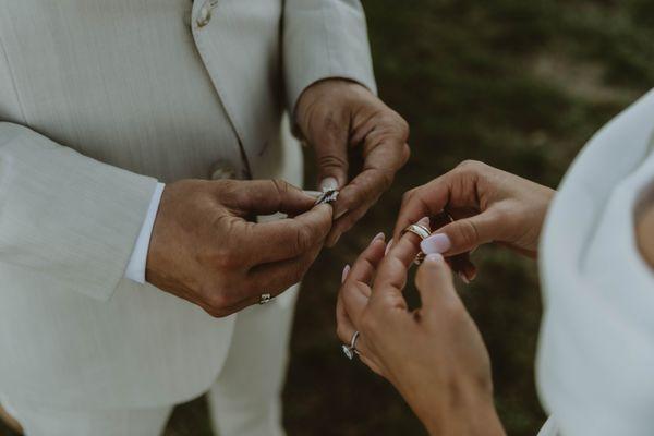 Bride and Groom exchange rings at their ceremony. The wedding was in Saunderstown, RI.