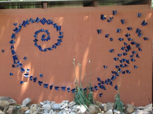 WALL OF HOPE, made of butterflies created from recycled aluminum cans.