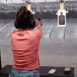 Female student in Introduction to Handgun Course