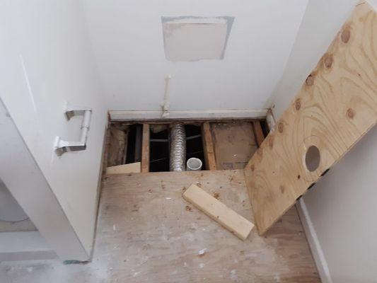 Rotten wood  from toilet bowl flange was cracked