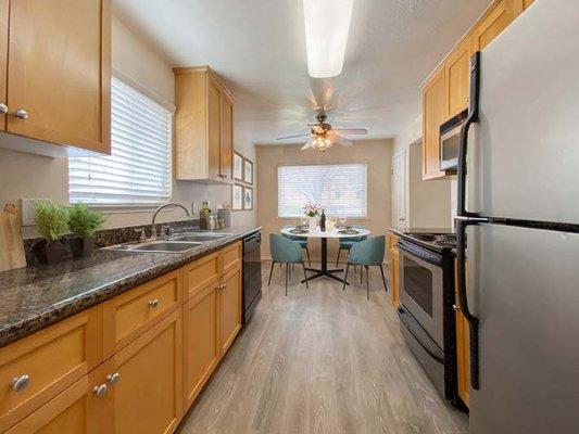 Kitchen and dining area at Pleasanton Place Apartment Homes