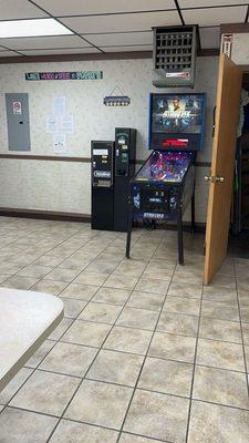 Pinball and change machine also near back room and detergent/dryer sheet/ fabric softener machine