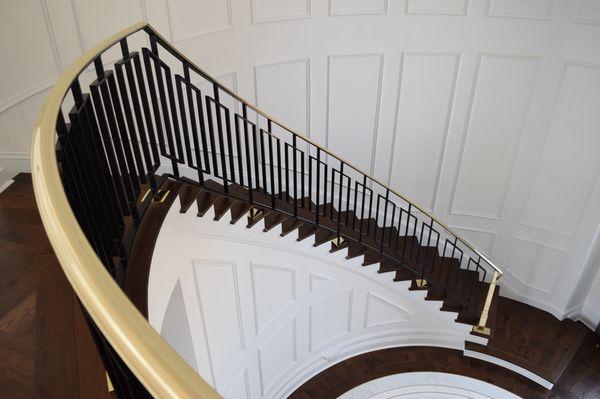 Brass cap and wrought iron handrail.