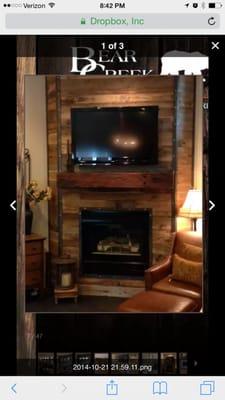 A different look for a fireplace. Barn wood and metal.