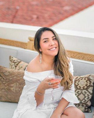 Owner and founder of Love for Wanderlust. Enjoying a cocktail at Azucar's rooftop in La Serena Villas.