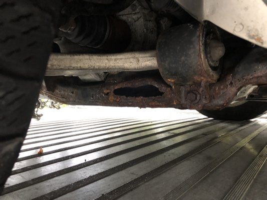 Both sides of frame rusted through.  How did they miss seeing that?  Oh, they wanted the other work so they passed the vehicle!