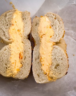 Onion bagel with Dorito cream cheese. $4.50 + tax + tip