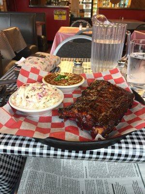 Half rack of baby back ribs, slaw and baked beans.