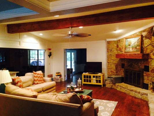 This beautiful living room was remodeled in 2013 in Edmond, Oklahoma. The new room features dark wood floors, a stone firepla...